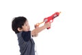 Cute asian boy playing toy gun Royalty Free Stock Photo