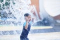 Cute asian boy playing at water park Royalty Free Stock Photo