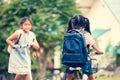 Cute asian child girl with backpack biking a bicycle Royalty Free Stock Photo