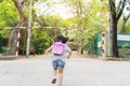 Cute asian child girl with backpack running and going to school with fun Royalty Free Stock Photo