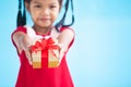 Cute asian child girl holding beautiful gift in hand Royalty Free Stock Photo