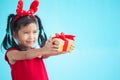 Cute asian child girl holding beautiful gift in hand Royalty Free Stock Photo