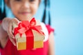 Cute asian child girl holding beautiful gift in hand Royalty Free Stock Photo