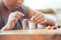 Cute asian child girl playing and creating with play dough Royalty Free Stock Photo