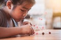 Cute asian child girl playing and creating with play dough Royalty Free Stock Photo