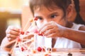 Cute asian child girl playing and creating with play dough Royalty Free Stock Photo