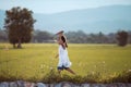 Cute asian child girl running and playing toy paper airplane Royalty Free Stock Photo