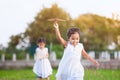 Cute asian child girl running and playing toy paper airplane Royalty Free Stock Photo