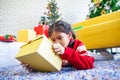 Asian child girl surprise with gift and holding beautiful gift box in hand on Christmas celebration Royalty Free Stock Photo