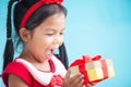 Cute asian child girl surprise with gift Royalty Free Stock Photo