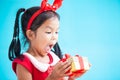 Cute asian child girl surprise with gift Royalty Free Stock Photo