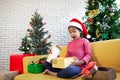 Asian child girl surprise with gift and holding beautiful gift in hand on Christmas celebration Royalty Free Stock Photo