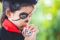 Asian child girl wearing halloween costumes and makeup making hands folded in prayer on Halloween celebration Royalty Free Stock Photo