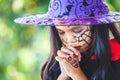 Asian child girl wearing halloween costumes and makeup making hands folded in prayer on Halloween celebration Royalty Free Stock Photo