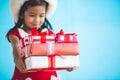 Cute asian child girl wearing santa hat and holding gift box Royalty Free Stock Photo