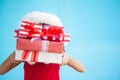 Cute asian child girl wearing santa hat and holding gift box Royalty Free Stock Photo