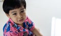 Cute Asian child little Thai boy 3 year old looking to camera and smile Royalty Free Stock Photo