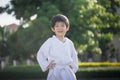 Cute Asian child in white kimono during training karate Royalty Free Stock Photo