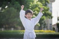 Cute Asian child in white kimono during training karate Royalty Free Stock Photo