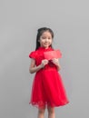 Cute Asian girl in chinese cheongsam and Tradition Chinese dress with red envelope , Chinese new year concept Royalty Free Stock Photo