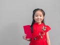 Cute Asian girl in chinese cheongsam and Tradition Chinese dress with red envelope , Chinese new year concept Royalty Free Stock Photo