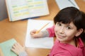 Cute asian girl doing homework. Royalty Free Stock Photo