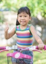 Cute asian girl enjoy to ride bicycle Royalty Free Stock Photo