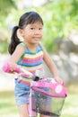 Cute asian girl enjoy to ride bicycle Royalty Free Stock Photo