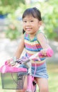 Cute asian girl enjoy to ride bicycle Royalty Free Stock Photo