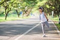 Cute asian girl exercise in gardent background Royalty Free Stock Photo