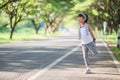 Cute asian girl exercise in gardent background Royalty Free Stock Photo