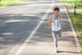 Cute asian girl exercise in gardent background Royalty Free Stock Photo