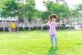 Cute Asian girl is exercising. Child standing and spread arms twist around. Kid smiled sweetly and laughed happily. Royalty Free Stock Photo