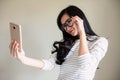 Cute Asian girl with glasses selfie Royalty Free Stock Photo