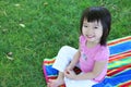Cute Asian Girl on Grass Royalty Free Stock Photo