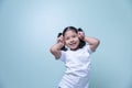 Cute Asian girl happily lovely attractive cheerful cheery very nice looking at the camera, taking a portrait isolated with copy Royalty Free Stock Photo