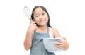 Cute asian girl holding cooking utensils