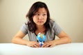 Cute Asian girl holding a globe Royalty Free Stock Photo