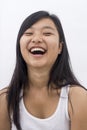 Cute happy asian girl on isolated background laughing Royalty Free Stock Photo