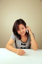 Cute Asian girl making a call Royalty Free Stock Photo