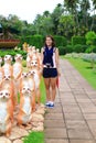 Cute asian girl with meetkat statue