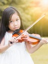 Cute asian girl play violin Royalty Free Stock Photo