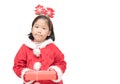 Cute asian girl in santa claus suit holding gift box Royalty Free Stock Photo