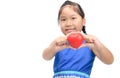 Cute asian girl show little red heart in hand isolated