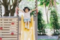 Cute asian girl smile play on school or kindergarten yard or playground. Healthy summer activity for children. Little asian girl Royalty Free Stock Photo