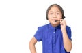 Cute asian girl is working as an operator at helpline talking with customer using headset Royalty Free Stock Photo