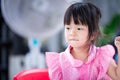 Cute Asian kid put on the lips. Adorable girl was thinking of something while she was relaxing. Royalty Free Stock Photo