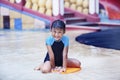 Cute Asian Kid smiling at swimming pool Royalty Free Stock Photo