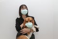 Cute asian lady wearing protective face mask with beagle dog wearing protective mask too