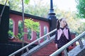 Cute Asian little beautiful girl play at autumn in the city park Royalty Free Stock Photo